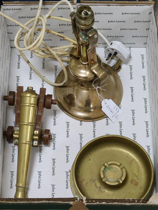 A Gimballed lamp, shell case, ashtray and brass cannon